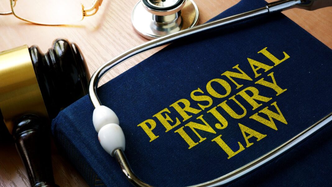 A personal injury cases law book and a doctor's stethoscope